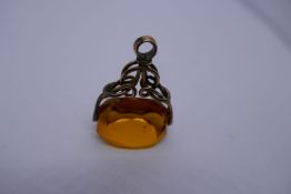 Antique seal pendant, with large yellow faceted stone and a 9ct AF ring, with diamond but central st