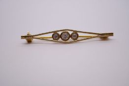 Italian 9ct yellow gold three stone brooch clear stone in a rubover setting, marked 9k, 4cm