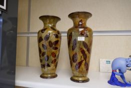 A large pair of Doulton stoneware vases of leaf design, 41cm - one of the vases has a repair at th