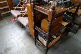 A Victorian mahogany three tier buffet on turned supports