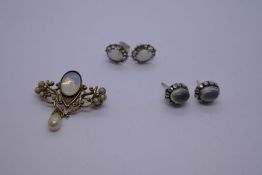 Yellow metal floral design brooch with oval moonstone hung with a single pearl, together with pair o