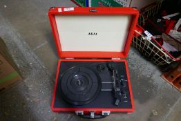 Cased Westminster portable gramophone, Red Cased Akai example and another