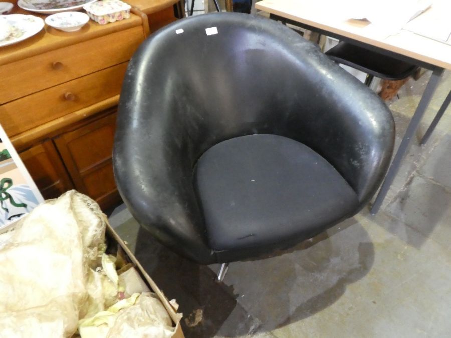 A vintage armchair on chrome revolving base