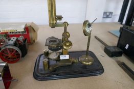 An antique Coxeter, London, brass microscope and similar