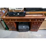 A Victorian mahogany twin pedestal desk having nine drawers