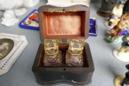 A Victorian ebonized and brass inlaid scent box having two brass inlaid bottles