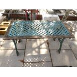 A garden table having pierced metal top