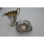 A silver pierced, pretty trinket pot of foliate design on three ball feet. Hallmarked Birmingham 189