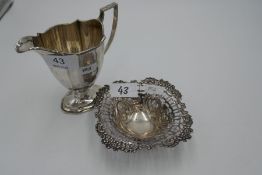 A silver pierced, pretty trinket pot of foliate design on three ball feet. Hallmarked Birmingham 189