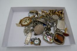 Tray of mixed costume jewellery to include a large oval silver locket, identity bracelet, pendants,