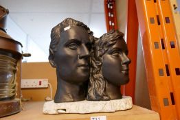 A modern sculpture of two heads