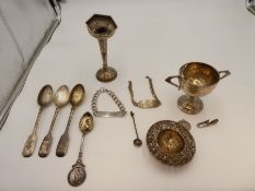 A quantity of silver items to include bracelets, an engraved silver Veteran's cup of 1934, silver te