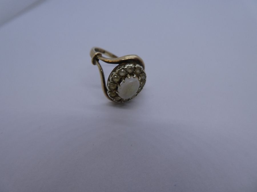 9ct yellow gold dress ring with central white opal surrounded clear stones, Split shoulder band, mar - Image 3 of 3