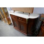 Two similar early 20th century inlaid mahogany sideboards, having carved panels with gilt metal moun