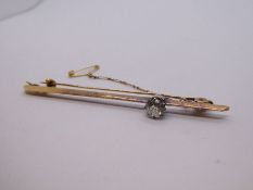 18ct yellow gold Sword edge bar brooch, with a single diamond, approx 0.6 carat, old mine cut, with