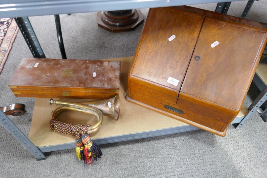 A late Victorian oak sloping stationery box, a copper bugle and a military box