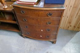 A reproduction bow front chest, having four drawers