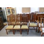 A set of seven early 20th century mahogany dining chairs having carved decoration (including one wit