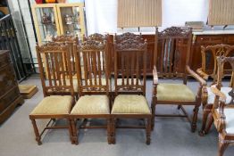 A set of seven early 20th century mahogany dining chairs having carved decoration (including one wit