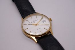 Asprey Garrard: A gent's 9ct yellow gold wristwatch on black leather strap, inscription to reverse '