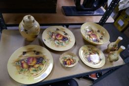 A quantity of Aynsley 'Orchard Gold' items to include plates and a ginger jar