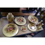 A quantity of Aynsley 'Orchard Gold' items to include plates and a ginger jar