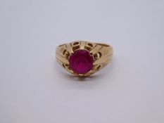 Gent's 14ct yellow gold signet ring with large central claw mounted red , marked 585, size Q, 5.1g a