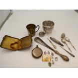 A quantity of items to include a German silver gilt cup, a possibly Georgian silver half reeded cup,