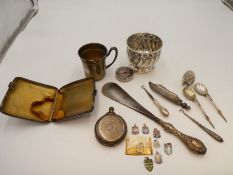 A quantity of items to include a German silver gilt cup, a possibly Georgian silver half reeded cup,