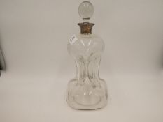 An Asprey & Co Ltd., George V silver rim decanter of unusual, decorative design. Hallmarked Birmingh