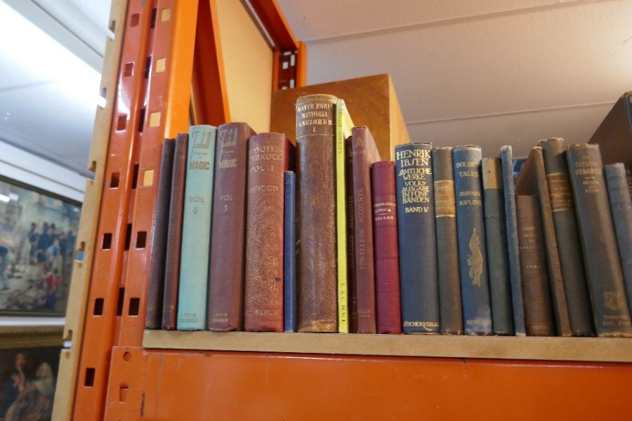 Shelf of antique and later leather bound and other books