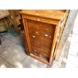 An old oak filing chest having two rows of drawers (A/F)