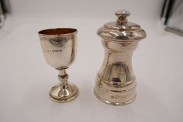 A small Georgian silver gilt trophy cup on a raised pedestal foot, hallmarked London, 1832. 8cm high