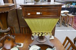 A Victorian mahogany sewing table having fitted top unit drawer and bag drawer under or an hexagonal