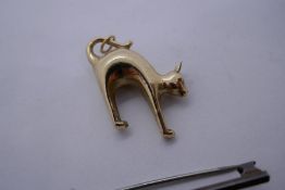 9ct yellow gold Cat charm, marked 375, approx.1.1g, together with a silver bar brooch with applied S
