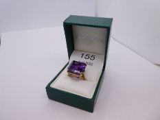 Modern 9ct yellow gold cocktail ring set large step cut amethyst marked 9ct, size O, 8g approx