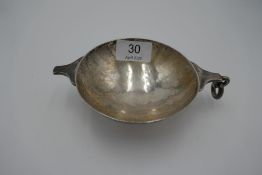 A George V silver Quaich with hammered body in the Arts and Crafts style. Having suspension loop to