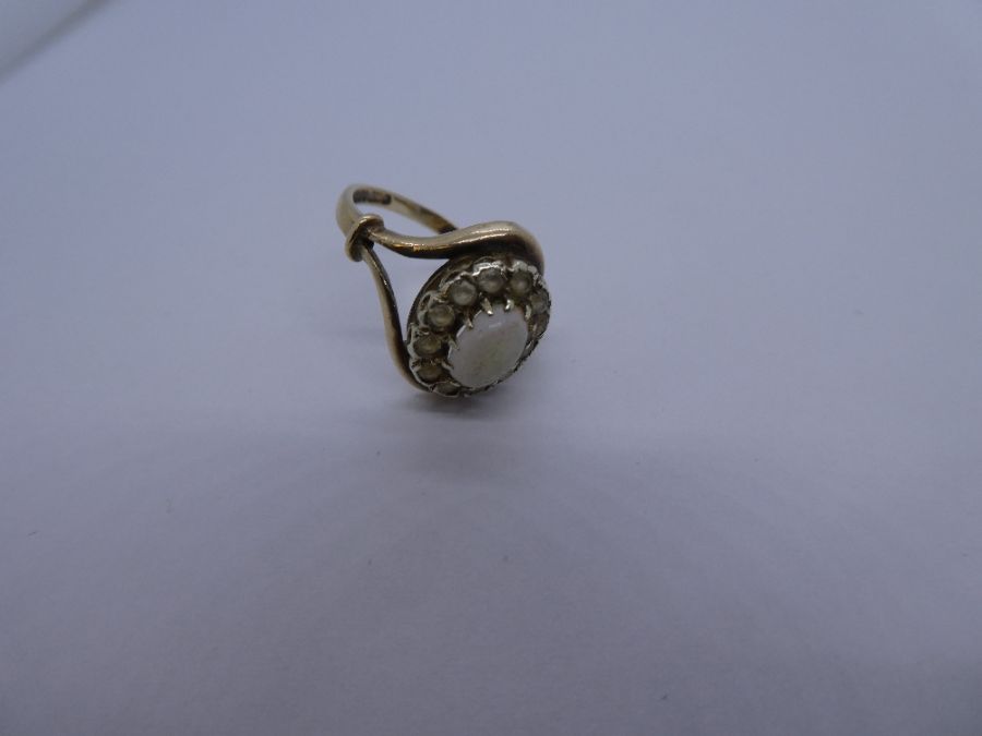 9ct yellow gold dress ring with central white opal surrounded clear stones, Split shoulder band, mar - Image 2 of 3