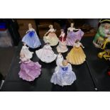 Ten Royal Doulton figures of ladies