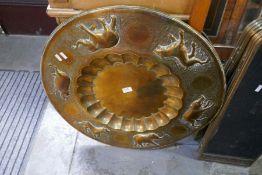 A large brass tray decorated elephants, a 1970s mirror and sundry