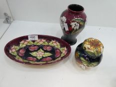 A modern Moorcroft vase decorated cherries, a similar oval dish and a small ginger jar