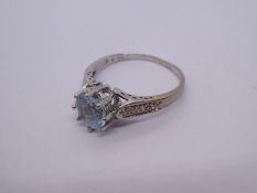 Contemporary 9ct white gold solitaire blue topaz ring with diamond chips inset to shoulders, size R,