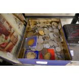 An old tin containing GB Coins