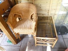 Two wicker armchairs and a cane coffee table