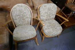 An Ercol light blond low open armchair and a similar rocking chair