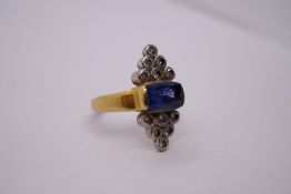 A sapphire and diamond Art Deco possibly 18ct yellow gold ring, with central elongated cushion shape