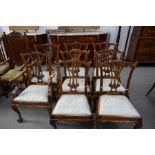 A set of eight reproduction Chippendale style dining chairs to include two with open arms (8)