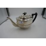 A silver half reeded teapot, decorative design. Hallmarked Birmingham 1929, Barker Brothers Silver L