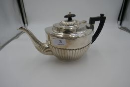 A silver half reeded teapot, decorative design. Hallmarked Birmingham 1929, Barker Brothers Silver L