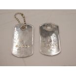 A pair of silver luggage tags stamped Gucci, made in Italy, total weight approx 1.18ozt